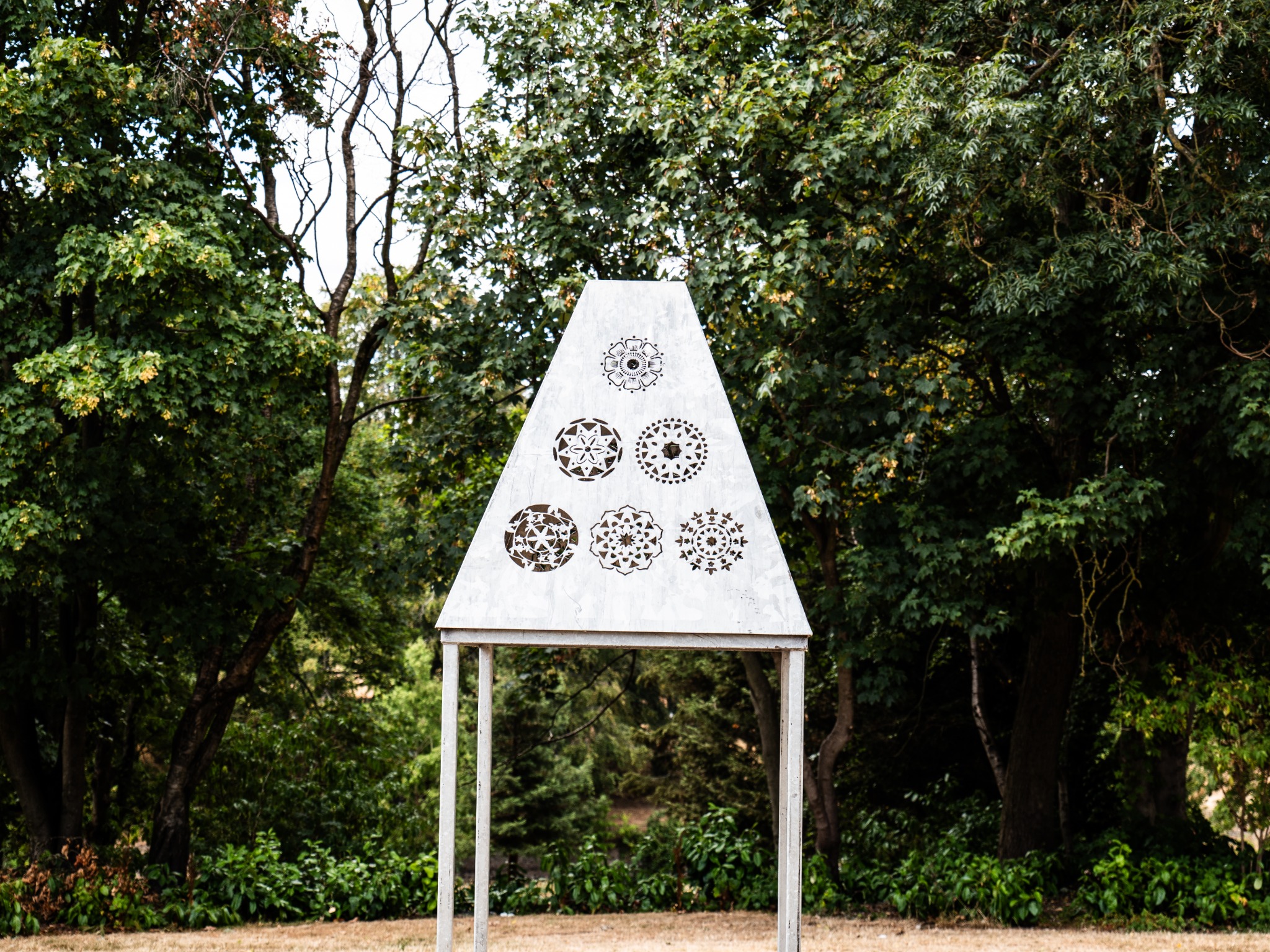 Adire motif structure in a wooded landscape